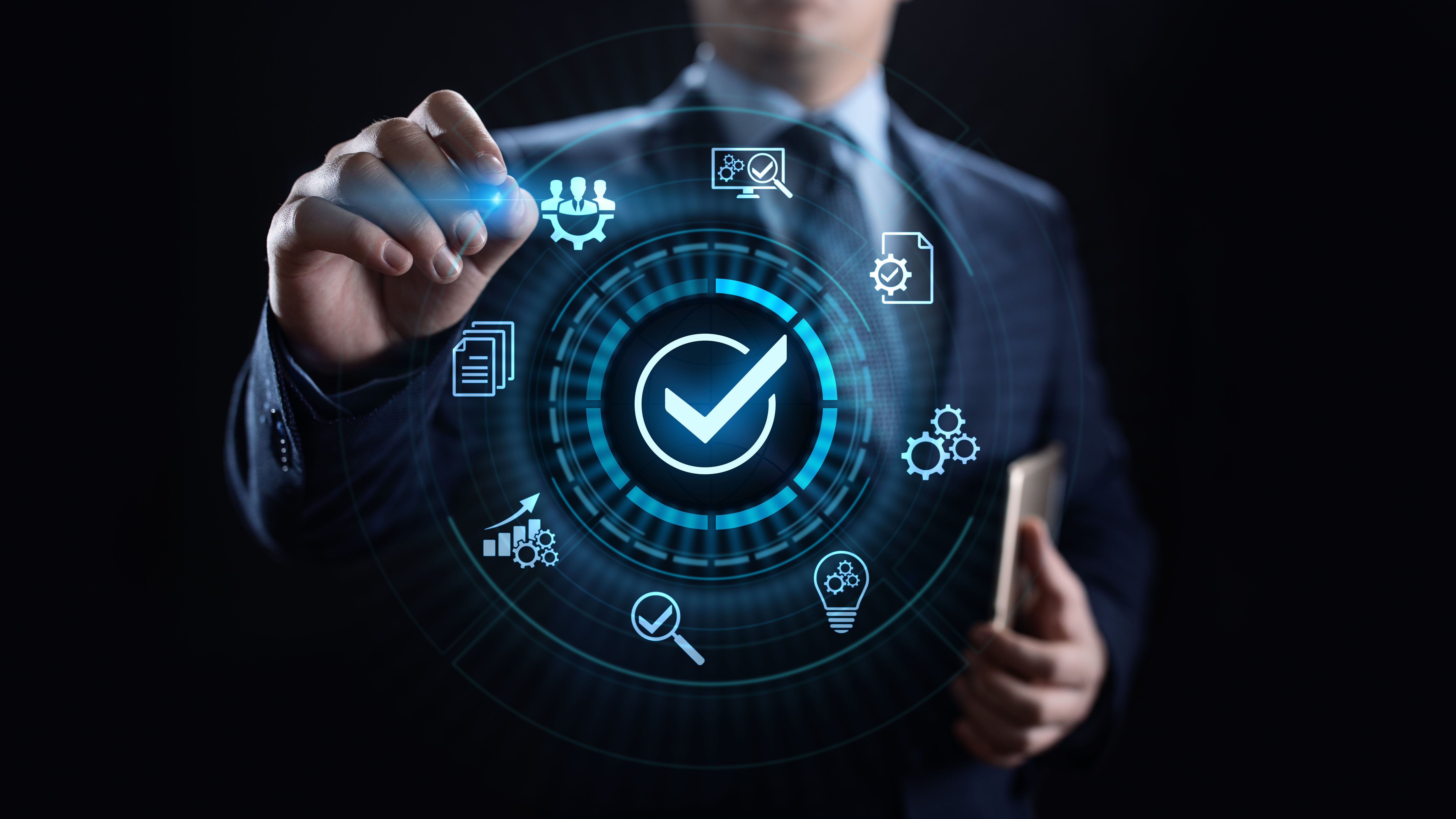 A man reviewing icons that include documents and quality checkmarks, indicating the importance of quality and assurance control in financial data processing.