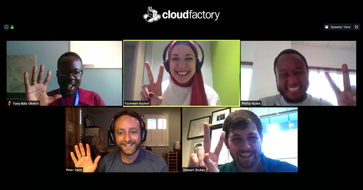 In this screenshot of a Zoom video meeting, five CloudFactory employees are smiling, laughing and making the peace symbol with their hands during the 17th pod social call of 2020.