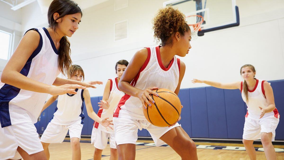 An image of girls playing basketball